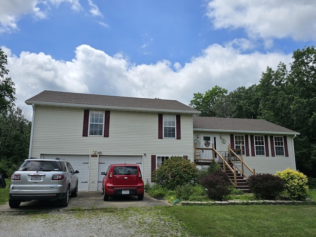 7951 N Marigold Ct, Columbia, MO 65202 - split level home with a garage, driveway, and a front yard
