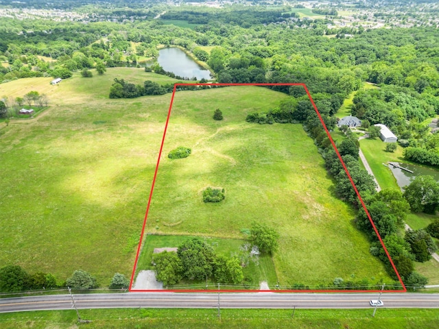 4410 N Creasy Springs Rd, Columbia, MO 65202 - aerial overview of property's location with property parcel outlined and a nearby body of water