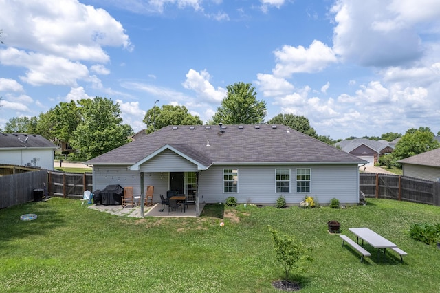 3810 Crocodile Dr, Columbia, MO 65202 - rear view of house featuring roof with shingles, a patio, and a fenced backyard