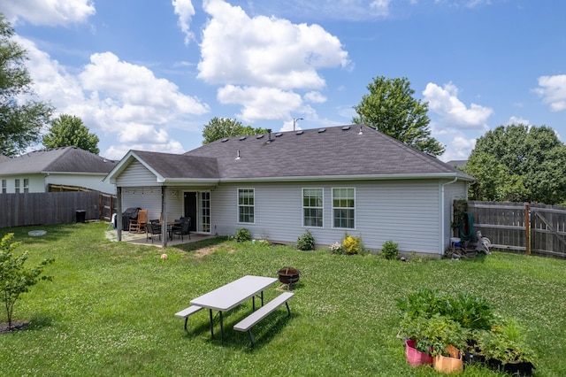 3810 Crocodile Dr, Columbia, MO 65202 - rear view of house featuring a fire pit, a patio, a fenced backyard, and a shingled roof