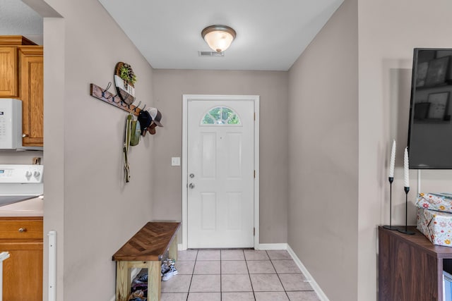 3810 Crocodile Dr, Columbia, MO 65202 - entryway featuring light tile patterned floors and baseboards