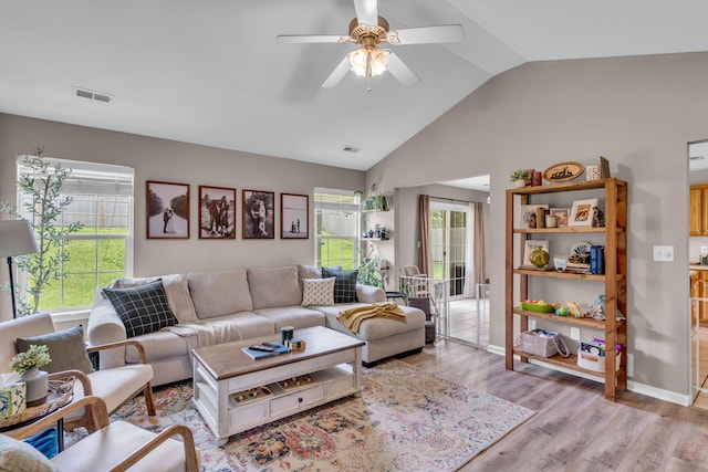 3810 Crocodile Dr, Columbia, MO 65202 - living area featuring vaulted ceiling, a ceiling fan, and light wood-style flooring