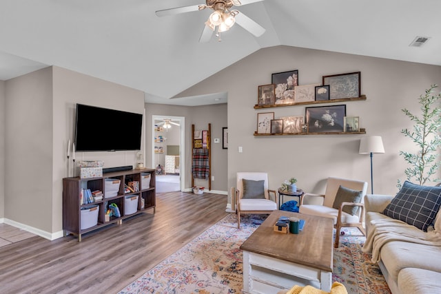 3810 Crocodile Dr, Columbia, MO 65202 - living area featuring a ceiling fan, wood finished floors, and vaulted ceiling