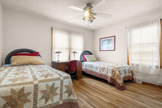 201 Ruby Ln, Columbia, MO 65203 - bedroom featuring multiple windows, light wood-style flooring, and ceiling fan