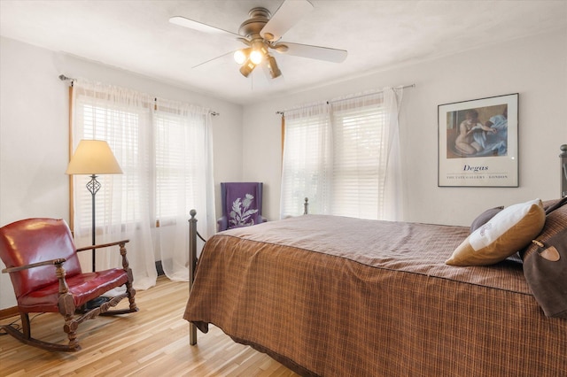 201 Ruby Ln, Columbia, MO 65203 - bedroom with light wood finished floors and ceiling fan