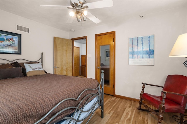 201 Ruby Ln, Columbia, MO 65203 - bedroom featuring light wood-type flooring and ceiling fan