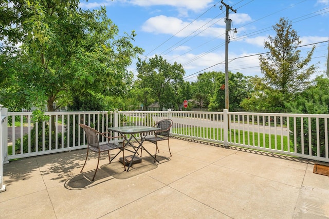 201 Ruby Ln, Columbia, MO 65203 - view of patio with outdoor dining space and view of scattered trees