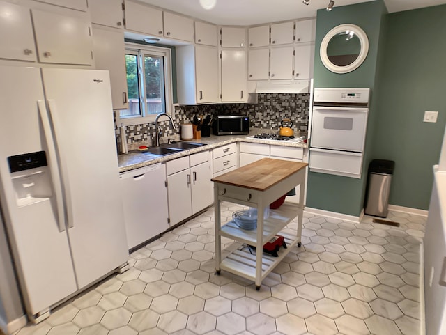 113 E El Cortez Dr, Columbia, MO 65203 - kitchen featuring white appliances, light countertops, white cabinetry, backsplash, and a warming drawer