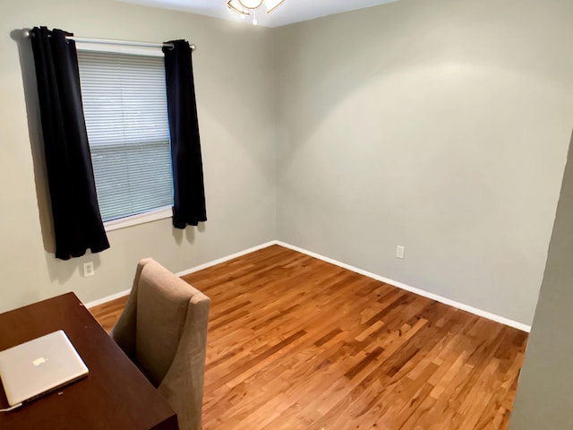 113 E El Cortez Dr, Columbia, MO 65203 - unfurnished office featuring wood finished floors and baseboards