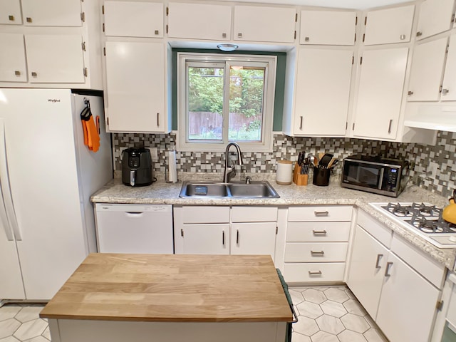 113 E El Cortez Dr, Columbia, MO 65203 - kitchen featuring white appliances, backsplash, white cabinets, and wood counters