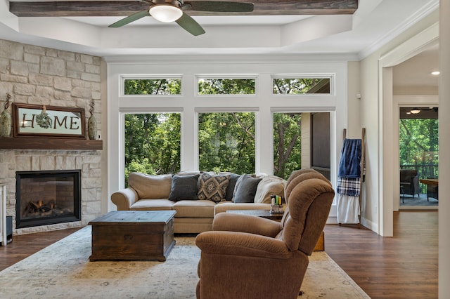1880 W Cresskill Dr, Columbia, MO 65203 - living area featuring a ceiling fan, a fireplace, dark wood-style floors, ornamental molding, and a raised ceiling