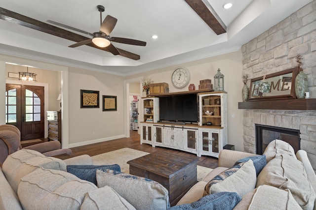 1880 W Cresskill Dr, Columbia, MO 65203 - living area with ceiling fan, wood finished floors, a stone fireplace, french doors, and a raised ceiling