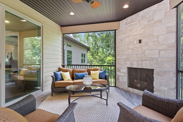 1880 W Cresskill Dr, Columbia, MO 65203 - sunroom with an outdoor living space with a fireplace and a ceiling fan