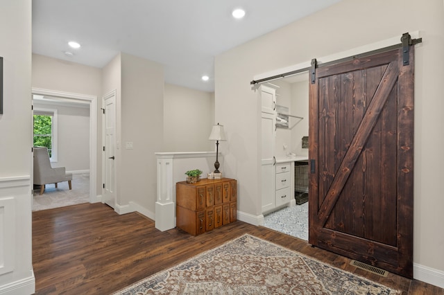 1880 W Cresskill Dr, Columbia, MO 65203 - entrance foyer featuring a barn door, wood finished floors, recessed lighting, and wine cooler