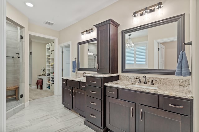 1880 W Cresskill Dr, Columbia, MO 65203 - bathroom featuring a stall shower, vanity, a spacious closet, and marble look tile flooring
