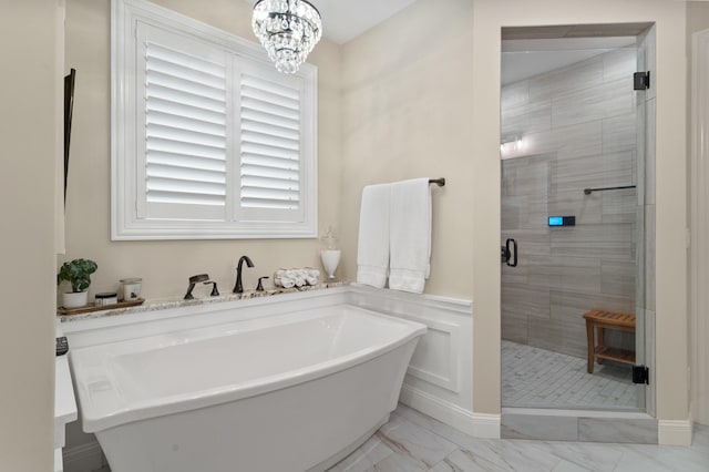 1880 W Cresskill Dr, Columbia, MO 65203 - full bathroom featuring a shower stall, a freestanding bath, a chandelier, and marble finish flooring