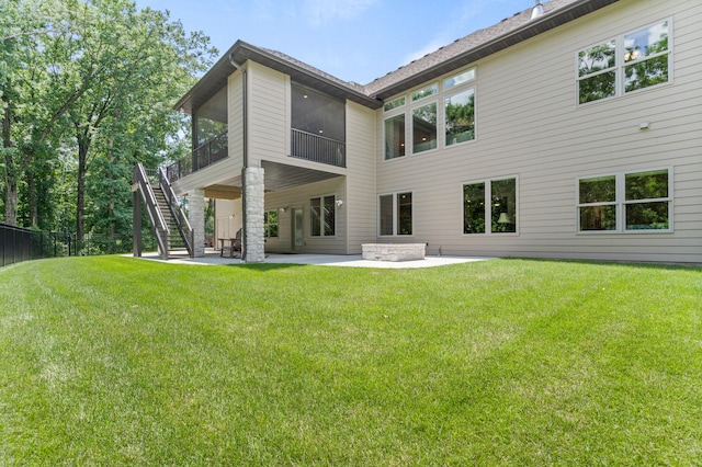 1880 W Cresskill Dr, Columbia, MO 65203 - back of property featuring a patio area, stairway, a sunroom, and a yard