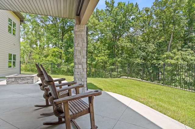 1880 W Cresskill Dr, Columbia, MO 65203 - fenced backyard featuring a patio, a fire pit, and view of wooded area