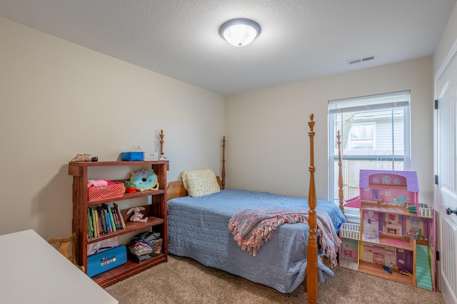 717 S Central St, Centralia, MO 65240 - bedroom featuring carpet flooring and a textured ceiling