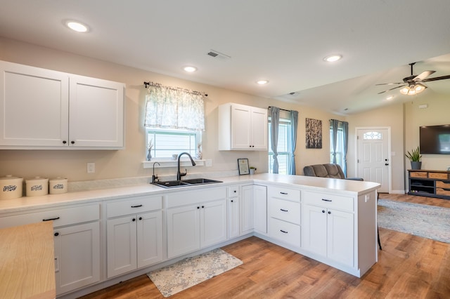 717 S Central St, Centralia, MO 65240 - kitchen featuring open floor plan, healthy amount of natural light, light wood finished floors, vaulted ceiling, and recessed lighting