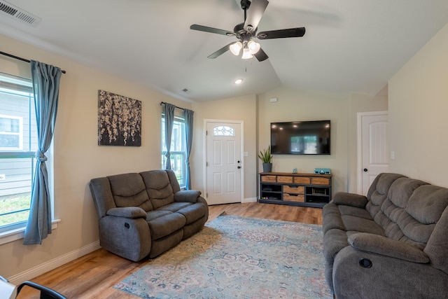 717 S Central St, Centralia, MO 65240 - living area with light wood finished floors, a ceiling fan, and vaulted ceiling