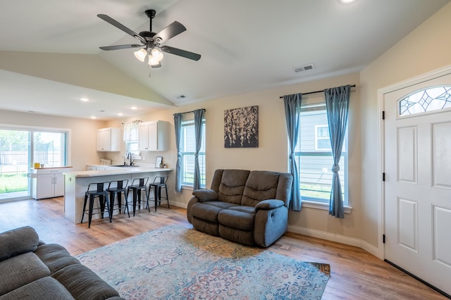 717 S Central St, Centralia, MO 65240 - living room with light wood-style flooring, plenty of natural light, a ceiling fan, vaulted ceiling, and recessed lighting