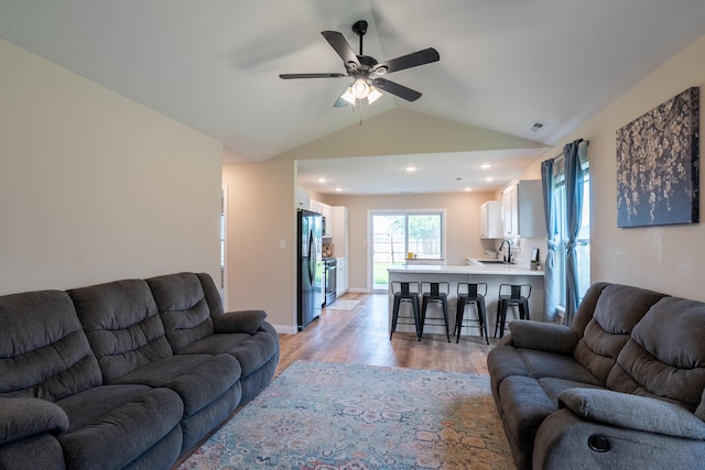 717 S Central St, Centralia, MO 65240 - living room featuring light wood-style floors, ceiling fan, vaulted ceiling, and recessed lighting