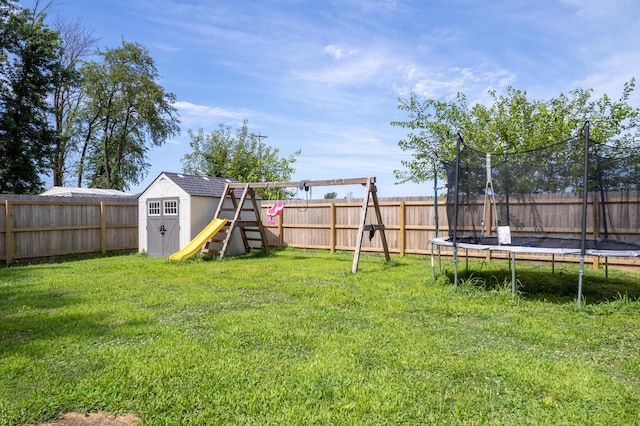 717 S Central St, Centralia, MO 65240 - fenced backyard with a trampoline and a storage shed