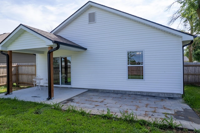 717 S Central St, Centralia, MO 65240 - back of house with a patio area and a shingled roof