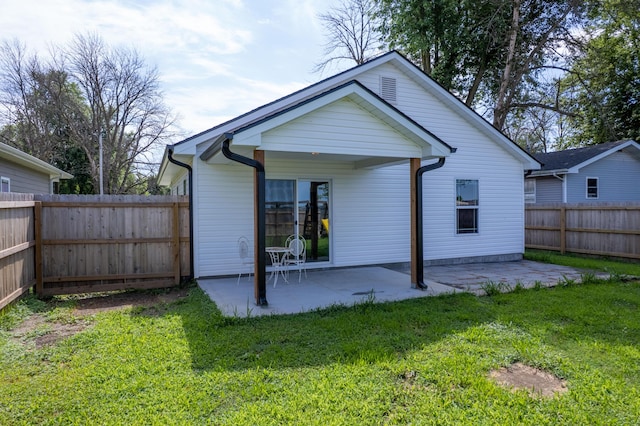 717 S Central St, Centralia, MO 65240 - rear view of house featuring a patio area and a fenced backyard