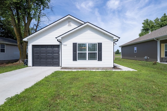 717 S Central St, Centralia, MO 65240 - ranch-style home with concrete driveway, an attached garage, and a front yard