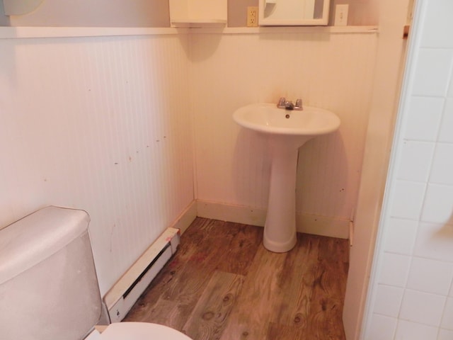 205 W Harrison St, Farber, MO 63345 - bathroom with a baseboard radiator and wood finished floors