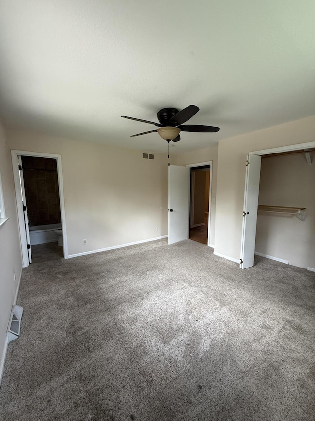 2220 N Lakeland Dr, Columbia, MO 65202 - unfurnished bedroom featuring carpet, ceiling fan, and ensuite bathroom
