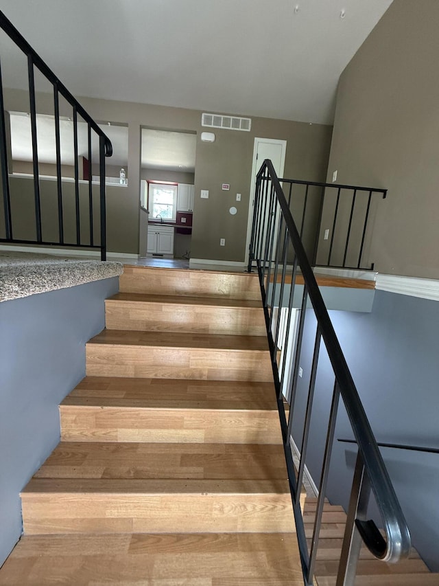 2220 N Lakeland Dr, Columbia, MO 65202 - staircase with wood finished floors