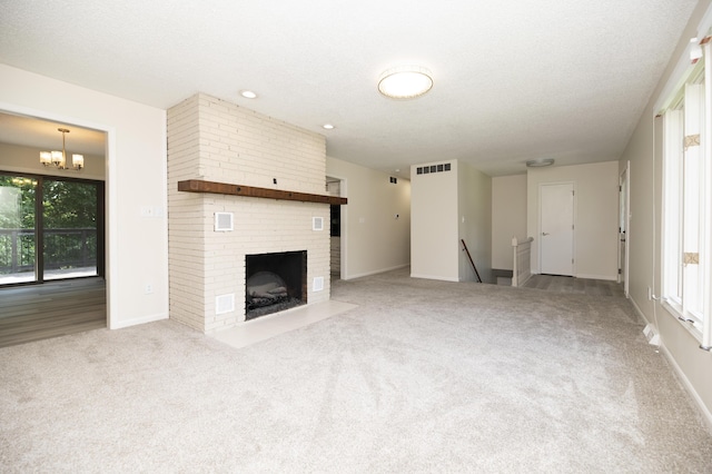 6303 S Old Village Rd, Columbia, MO 65203 - unfurnished living room featuring carpet floors, a fireplace, and a chandelier