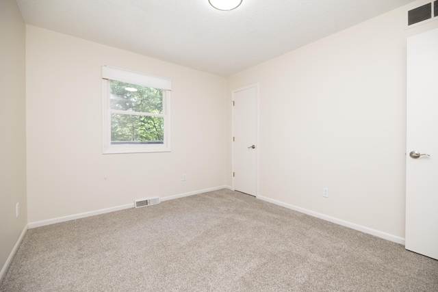 6303 S Old Village Rd, Columbia, MO 65203 - unfurnished room with light carpet and baseboards