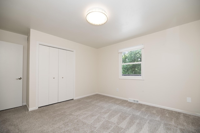 6303 S Old Village Rd, Columbia, MO 65203 - unfurnished bedroom with carpet and a closet