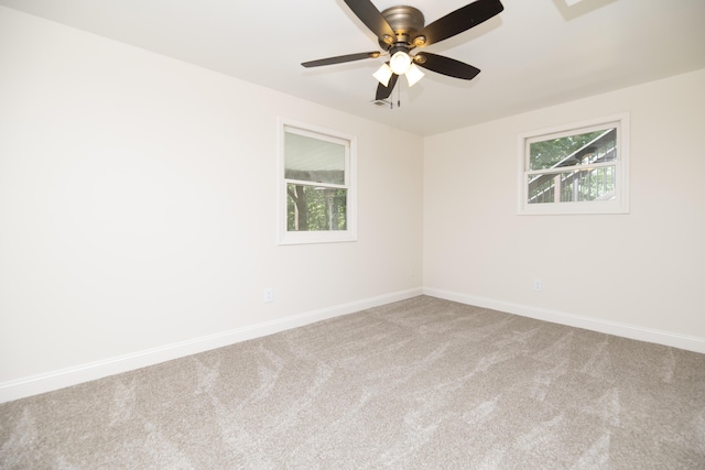6303 S Old Village Rd, Columbia, MO 65203 - carpeted spare room with healthy amount of natural light and a ceiling fan