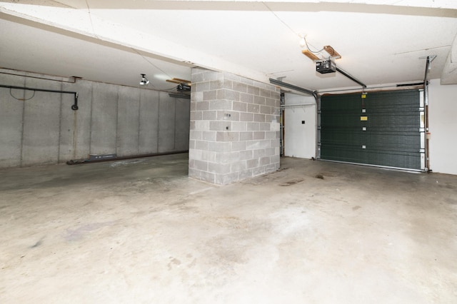 6303 S Old Village Rd, Columbia, MO 65203 - garage with a garage door opener and concrete block wall