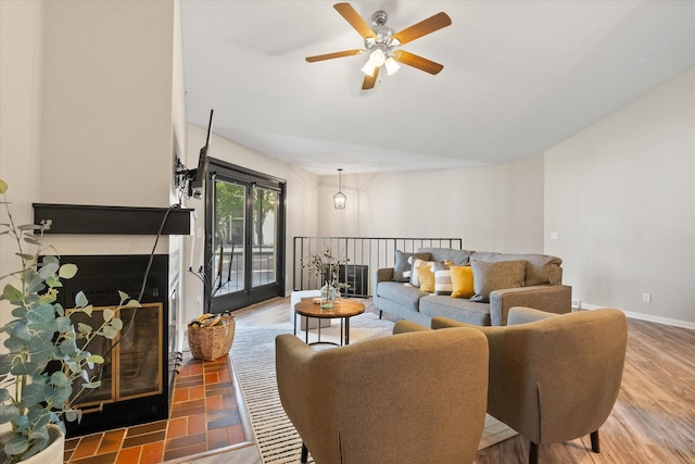 706 Park Deville Pl, Columbia, MO 65203 - living area with a ceiling fan and a fireplace with raised hearth