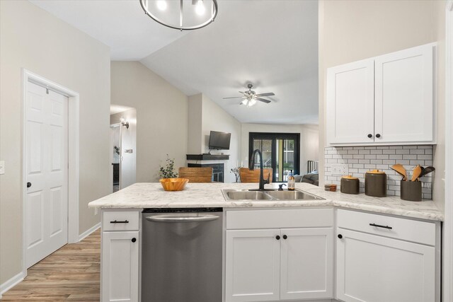 706 Park Deville Pl, Columbia, MO 65203 - kitchen featuring dishwasher, vaulted ceiling, a peninsula, light wood finished floors, and a ceiling fan