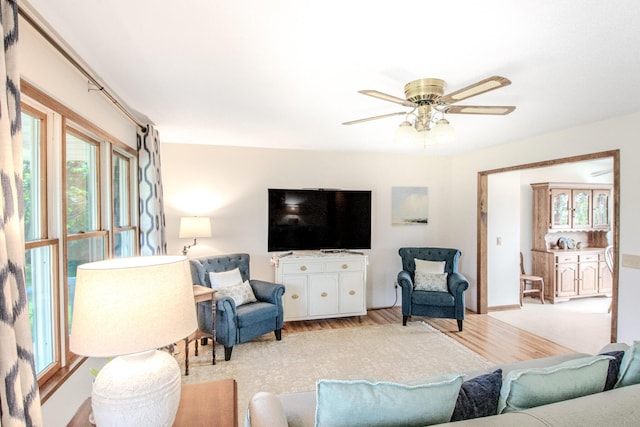 11657 Fletcher Ln, Holts Summit, MO 65043 - living area with light wood finished floors and a ceiling fan