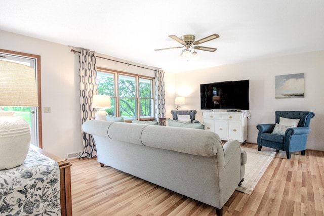 11657 Fletcher Ln, Holts Summit, MO 65043 - living area featuring light wood-style flooring and ceiling fan