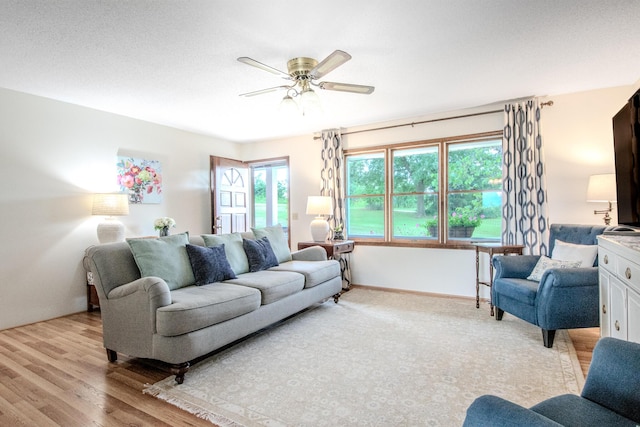 11657 Fletcher Ln, Holts Summit, MO 65043 - living area with ceiling fan and light wood-style flooring