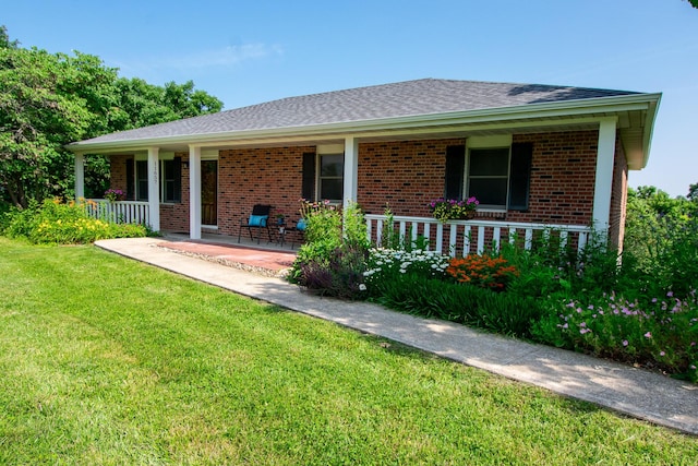 11657 Fletcher Ln, Holts Summit, MO 65043 - ranch-style house featuring covered porch, brick siding, a front yard, and roof with shingles