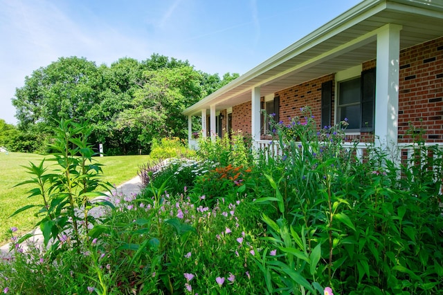 11657 Fletcher Ln, Holts Summit, MO 65043 - view of grassy yard featuring a porch