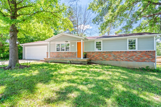 5704 N Teresa Dr, Columbia, MO 65202 - ranch-style house featuring brick siding, an attached garage, and a front lawn