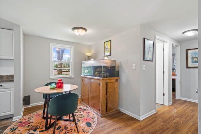 5704 N Teresa Dr, Columbia, MO 65202 - dining room with light wood-style flooring and baseboards