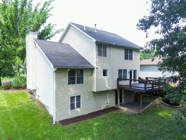3712 Godfrey Dr, Columbia, MO 65203 - rear view of house featuring roof with shingles, a wooden deck, a chimney, and a yard