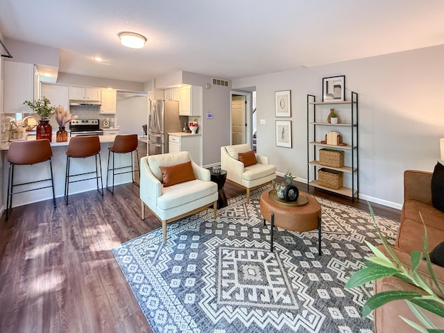 3712 Godfrey Dr, Columbia, MO 65203 - living area featuring dark wood-style floors and baseboards